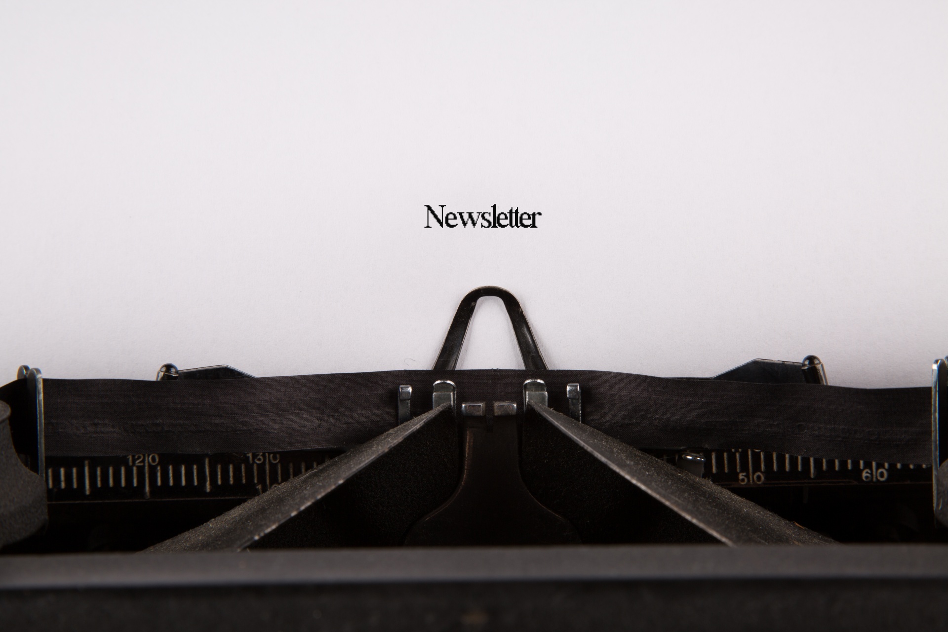 The word newsletter on a page typed on an old typewriter. Photo by George Hodan, Public Domain